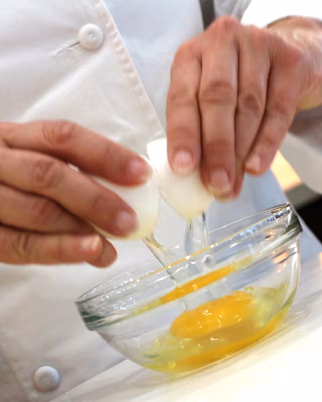 adding egg to cookie dough